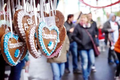 Close-up of heart shape food hanging at market in city