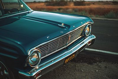 Close-up of vintage car on street