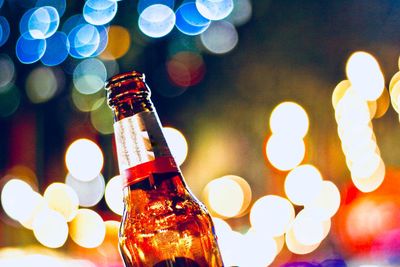 Close-up of wine bottles against blurred background