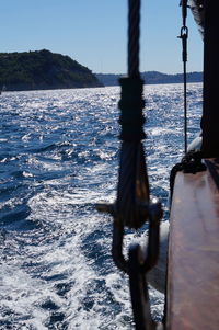 Nautical vessel on sea against clear sky