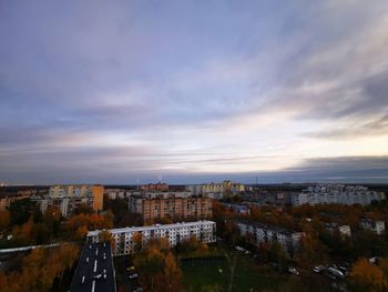 High angle view of buildings against sky at sunset