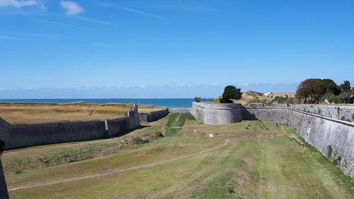 Scenic view of landscape against blue sky