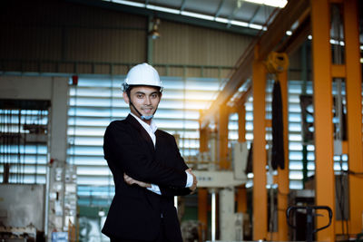 Young man wearing hat standing at home