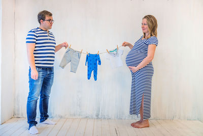 Couple holding clothesline