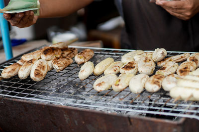 Midsection of man preparing food