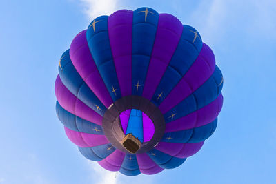 Low angle view of hot air balloons against sky