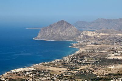 High angle view of bay against clear blue sky