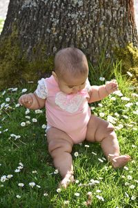 Cute baby girl on field