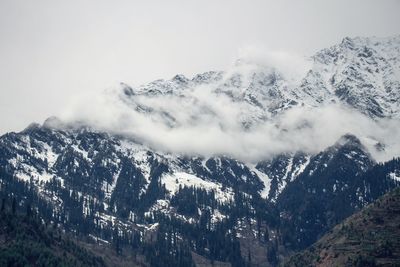 Scenic view of snow mountains against sky