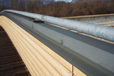 High angle view of pipes on railing