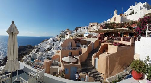 High angle view of buildings against blue sky