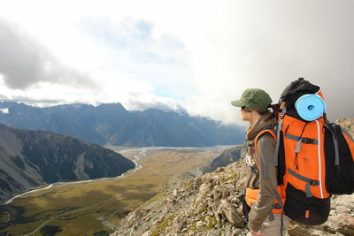 Panoramic view of people on mountain against sky