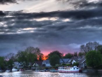 Boats in lake against sky