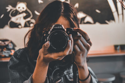 Portrait of woman photographing