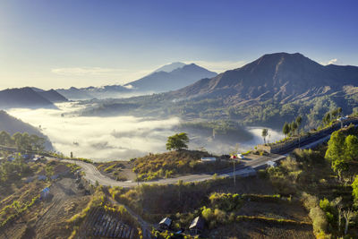 Scenic view of landscape and mountains against sky