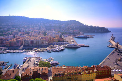 High angle view of sea and buildings against sky