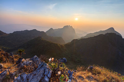 Scenic view of mountains against sky during sunset