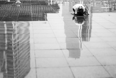 View of woman praying outdoors