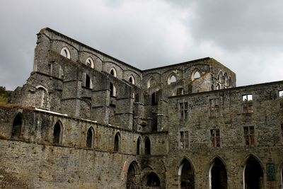 Low angle view of old building against sky