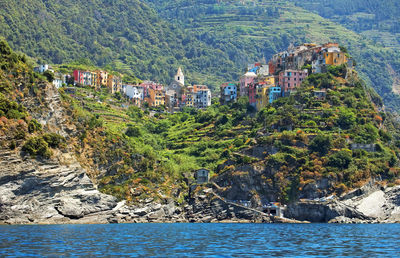 Scenic view of townscape by sea