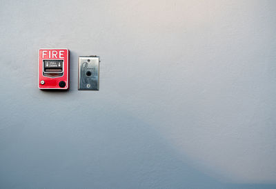 Close-up of telephone booth on wall