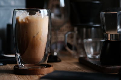 Ice coffee in morning , latte coffee on wood table