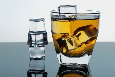 Close-up of drink against white background