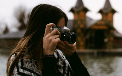 Portrait of woman photographing