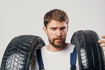 Portrait of mid adult man against white background