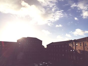 Low angle view of buildings against sky during sunset