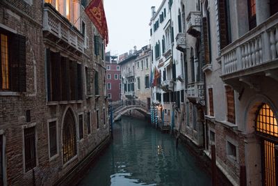 Canal amidst buildings