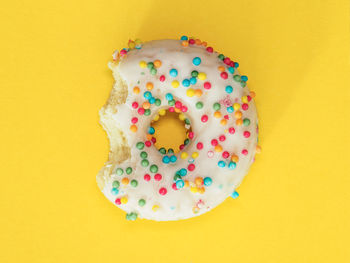 Close-up of donut on yellow background