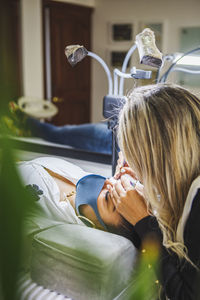 Woman lying down on bed