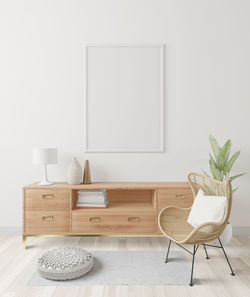 Empty chairs and table against wall at home