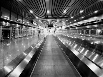 Moving walkway in illuminated modern building