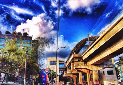 Buildings against cloudy sky