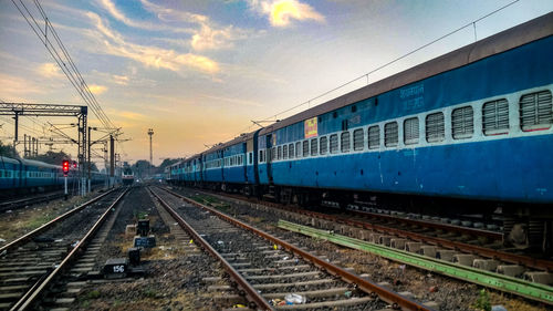 Train at railroad station against sky