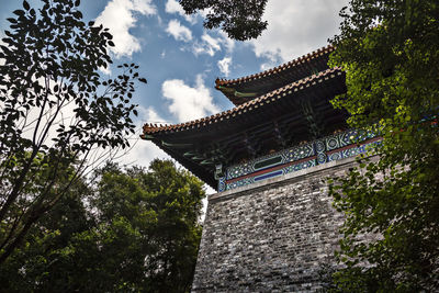 Low angle view of ming xiaoling mausoleum by trees