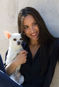 Portrait of young woman with dog