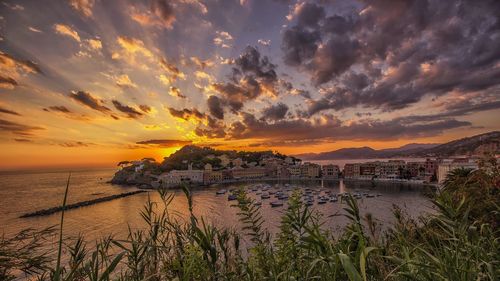 Scenic view of sea against sky at sunset