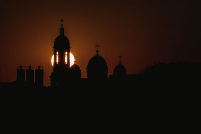 Silhouette cathedral against sky during sunset