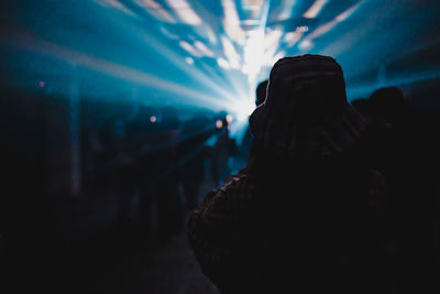 Rear view of silhouette woman at music concert