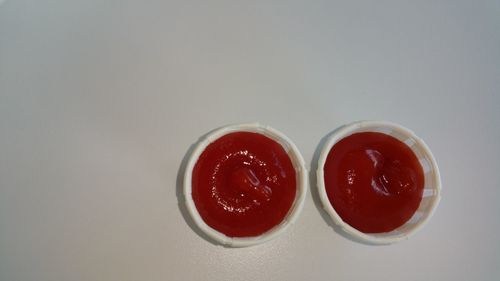 Close-up of red wine on white background