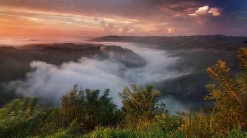 Scenic view of mountains against sky during sunset