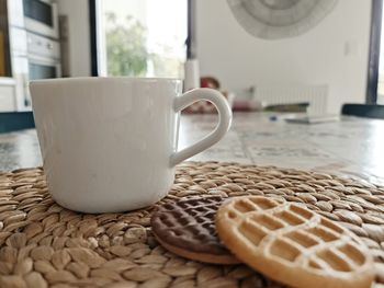 Close-up of coffee cup on table