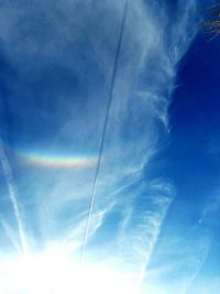 Low angle view of vapor trails in sky