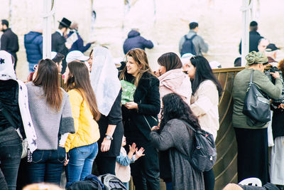 Group of people standing in city