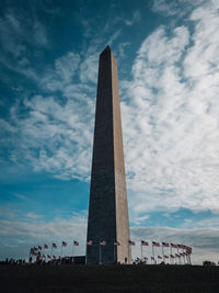 Low angle view of historical building against cloudy sky