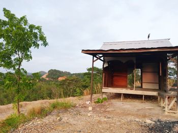 House on field against sky