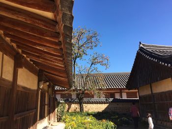 Low angle view of building against clear blue sky